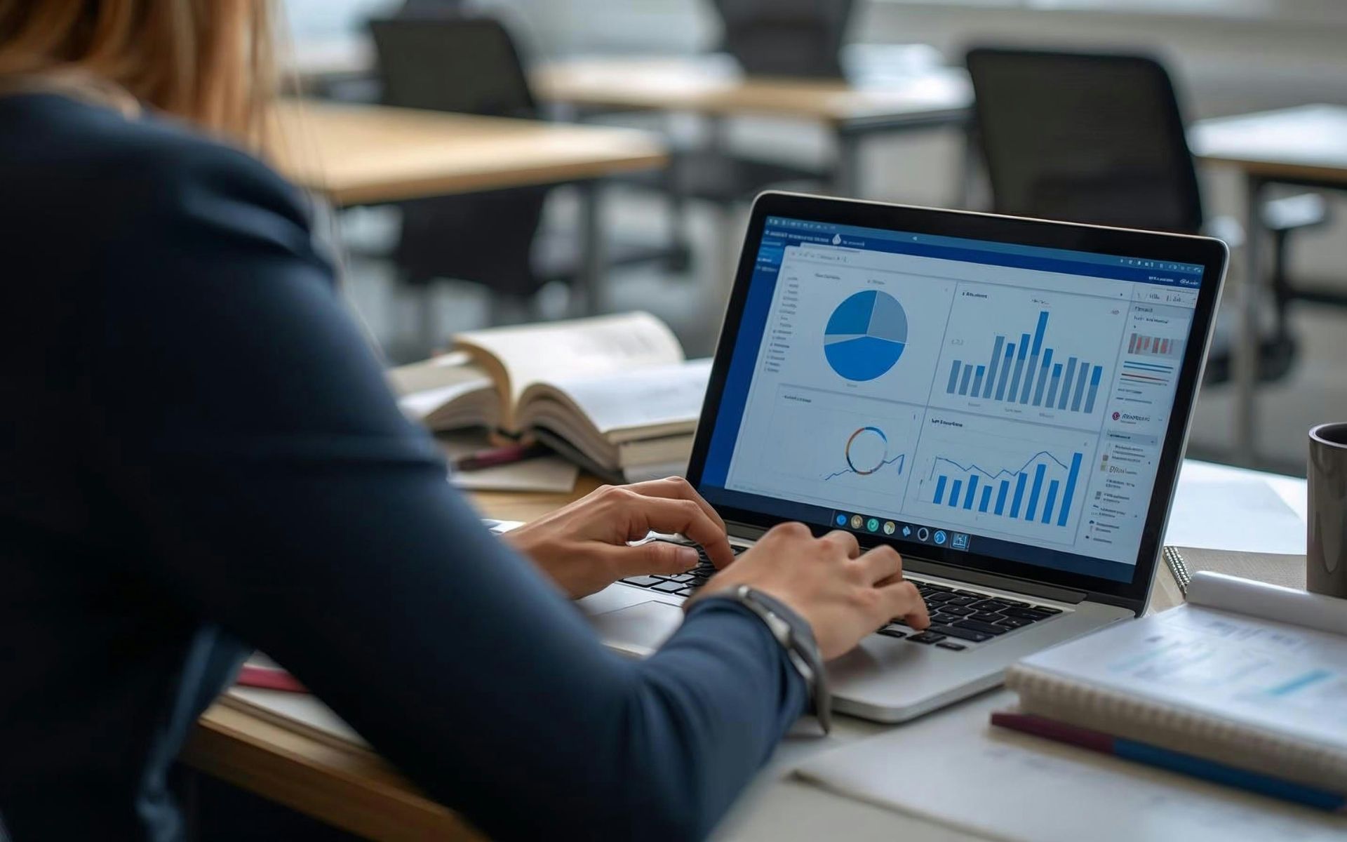 Manager analizza dashboard con dati e grafici su laptop — adozione AI e trasformazione digitale nelle aziende italiane 2026