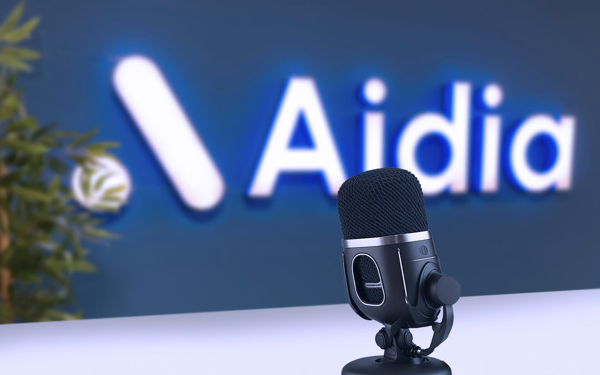 Aidia Office: the logo at the entrance with a microphone in front