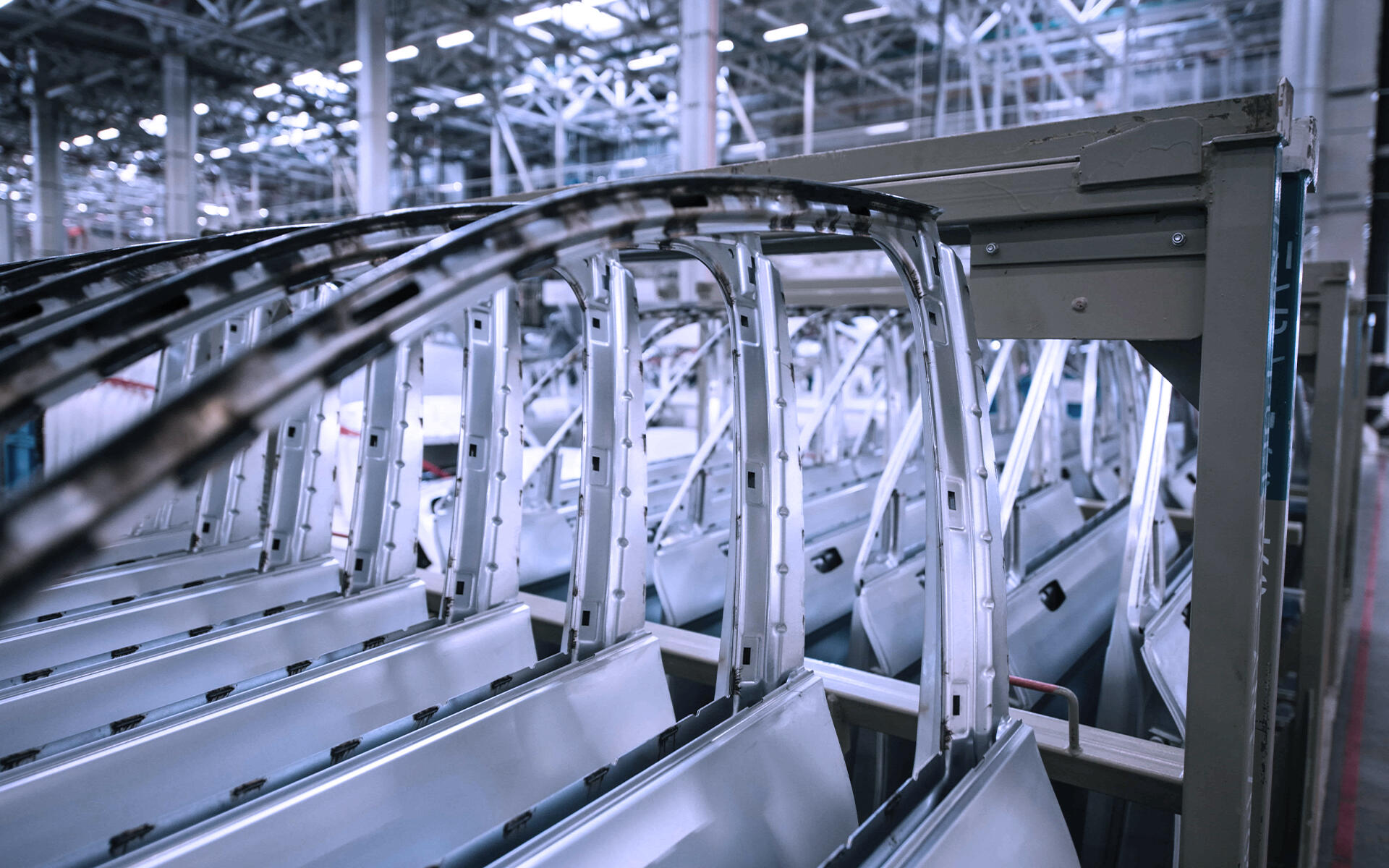 A car door still in production, inside an automotive industrial plant